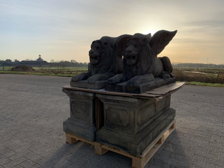 Pair of Winged Lions on Pedestals